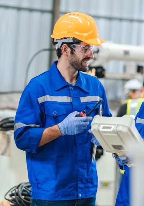 Engineer robot service working in factory, Worker team work to robotic arm software programming